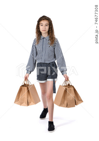 Child with a packet isolated on white 74677308