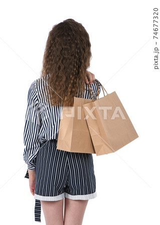 Child with a packet isolated on white 74677320