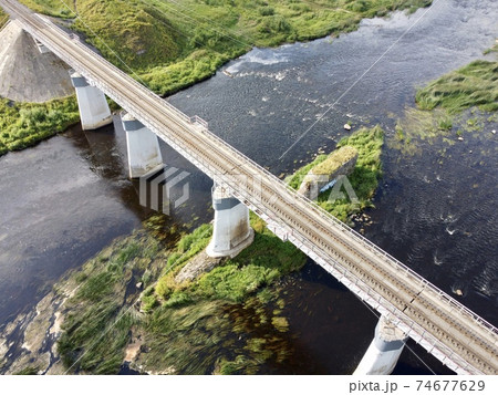 railway bridge over the river 74677629