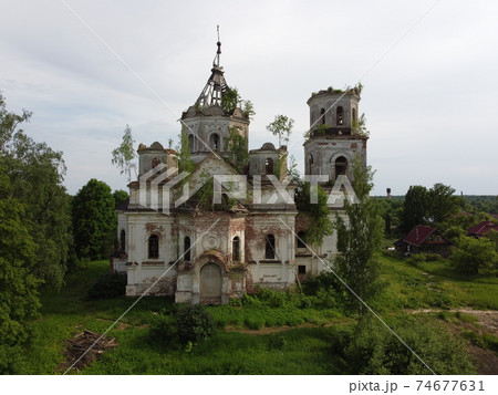 an old building with grass and trees,aerial photo 74677631
