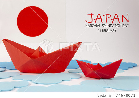 Japan flag with two red origami boat. 74678071