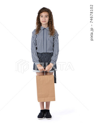 Child with a packet isolated on white Child with a packet isolated on white 74678102