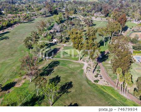 Aerial view over golf field. 74679934