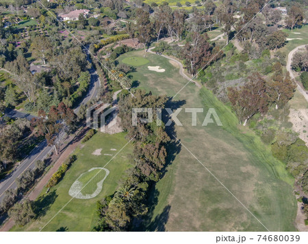 Aerial view over golf field. 74680039