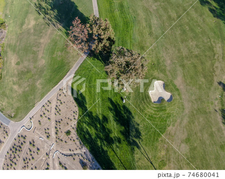 Aerial view over golf field. Aerial view over golf field. 74680041