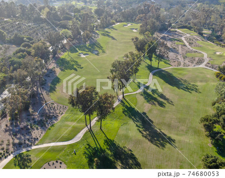 Aerial view over golf field. Aerial view over golf field. 74680053