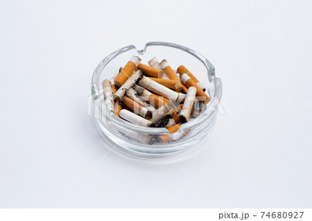 Smoked cigarettes on white background. 74680927