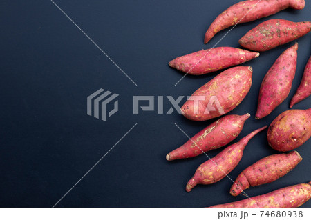 Sweet potato on dark background. Top view 74680938
