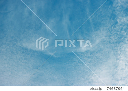 Partly cloudy in the blue sky. Partly cloudy in the blue sky. 74687064