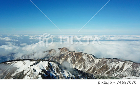 Snow forest in the mountains, above the clouds. Snow forest in the mountains, above the clouds. 74687070