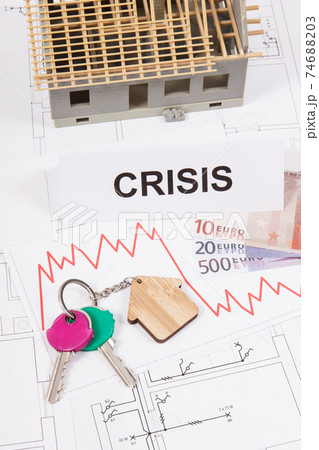 Keys, inscription crisis, euro and downward graphs representing crisis of real estate market Keys, inscription crisis, euro and downward graphs representing crisis of real estate market 74688203
