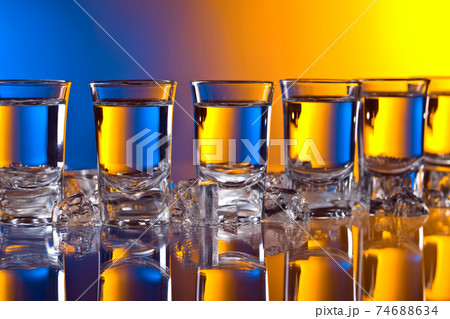 Glasses of vodka . Glasses of vodka . 74688634