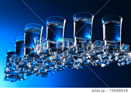 Glasses of vodka with ice. Glasses of vodka with ice. 74688638