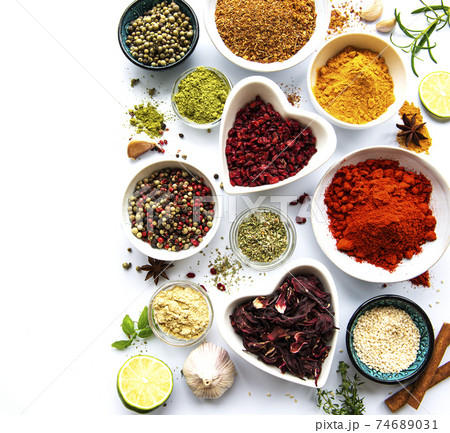 Various spices in a bowls  on white  background. Top view copy space. 74689031