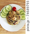 Asian cuisine-Homemade egg fried rice served with vegetables 74689793