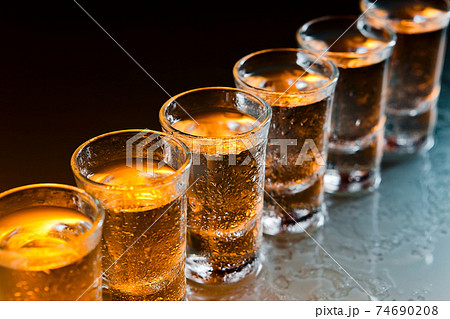 Glasses with an alcoholic drink 74690208