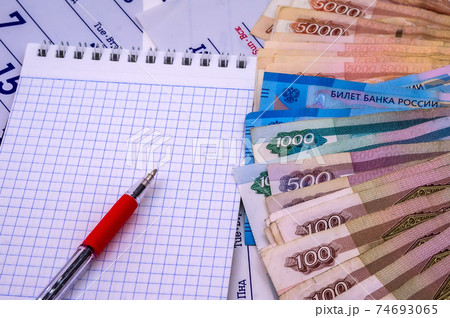 calendar for 2021, budget planning, sales strategy for the next year, Notepad and money calendar for 2021, budget planning, sales strategy for the next year, Notepad and money 74693065