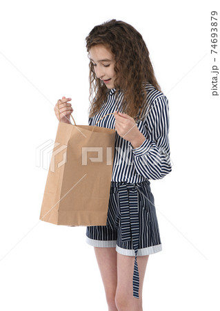 Child with a packet isolated on white 74693879