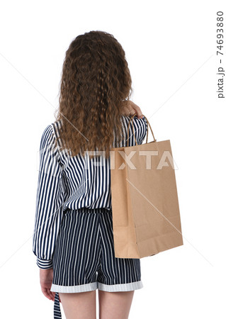 Child with a packet isolated on white 74693880