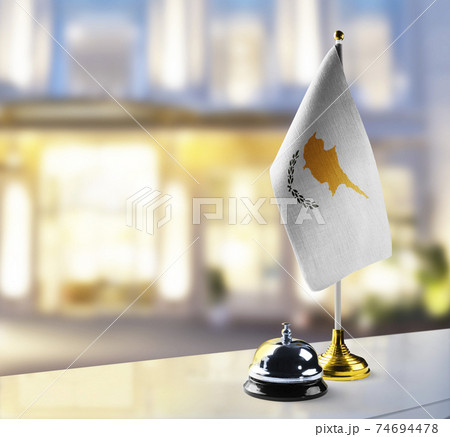 Cyprus flag on the reception desk in the lobby of the hotel Cyprus flag on the reception desk in the lobby of the hotel 74694478