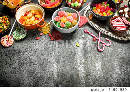 Multicolored candy, jelly and marshmallows in a bowl. Multicolored candy, jelly and marshmallows in a bowl. 74694989