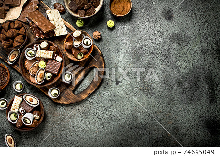Chocolate sweets with cocoa powder. 74695049