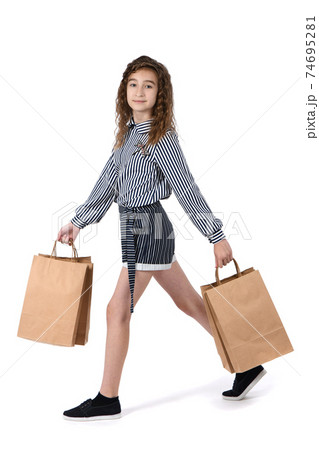 Child with a packet isolated on white 74695281