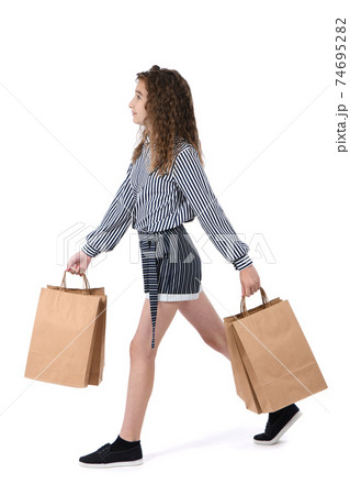 Child with a packet isolated on white 74695282
