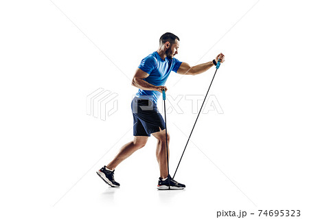 Caucasian professional male runner, athlete training isolated on white studio background. Copyspace for ad. Caucasian professional male runner, athlete training isolated on white studio background. Copyspace for ad. 74695323