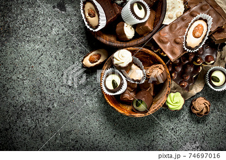 Chocolate candies in a bowls. Chocolate candies in a bowls. 74697016