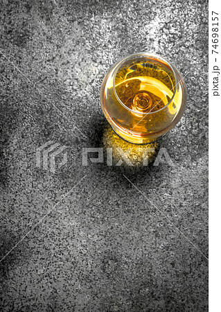 glass of French cognac. 74698157