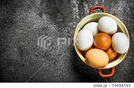Fresh eggs in a bowl. Fresh eggs in a bowl. 74698593