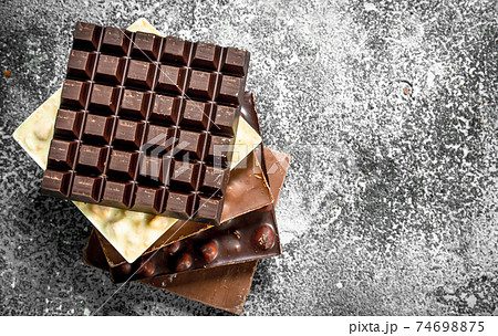 Dark, white and chocolate with nuts. Dark, white and chocolate with nuts. 74698875