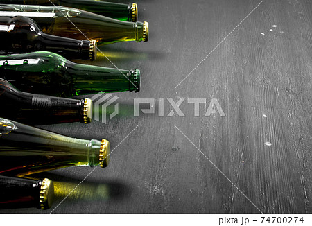 Bottles with fresh beer. Bottles with fresh beer. 74700274