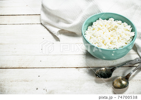 Cottage cheese from fresh milk in a bowl. Cottage cheese from fresh milk in a bowl. 74700538