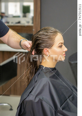 Woman with wet long hair Woman with wet long hair 74701911