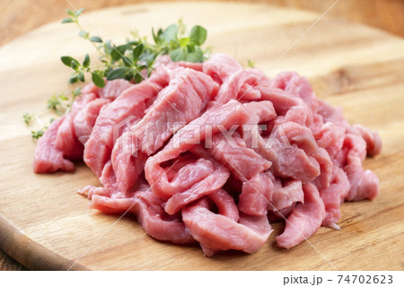 Raw veal strips for traditional Swiss zurcher geschnetzeltes  74702623