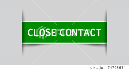 Label sticker green color in word close contact that inserted in gray background 74703634