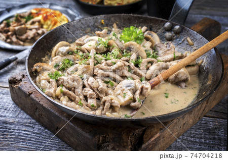 Traditional Swiss zuercher geschnetzeltes with roesti 74704218