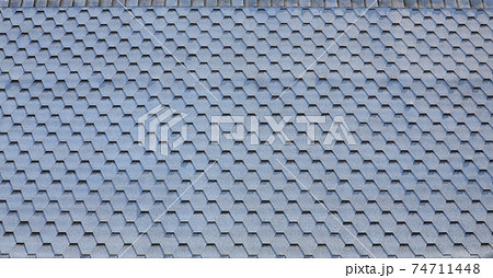 Modern roofing and decoration of chimneys. Flexible bitumen or slate shingles 74711448