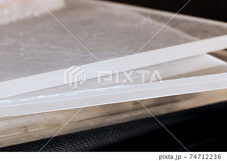 Sheets of chopped glass close up on black background 74712236