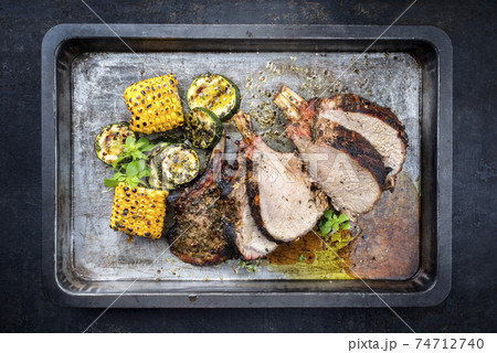 Exotically barbecue veal back racks squares roast with green asaparagus and pineapple 74712740