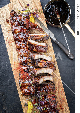 Tradtional barbecue spare ribs baby back style with hot honey chili marinade Tradtional barbecue spare ribs baby back style with hot honey chili marinade 74712747