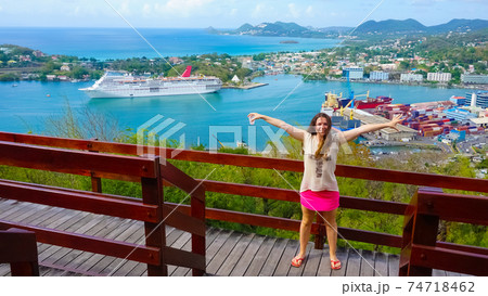 The woman posing against port or cruise dock at Saint Lucia island The woman posing against port or cruise dock at Saint Lucia island 74718462