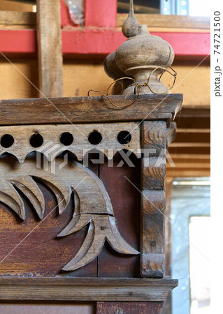Old russian carved wooden window trim with funny wire spectacles Old russian carved wooden window trim with funny wire spectacles 74721500
