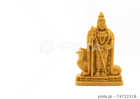 The hand-carved wooden statue of Lord Murugan is isolated on a white background The hand-carved wooden statue of Lord Murugan is isolated on a white background 74722318