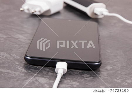 External powerbank charging empty battery of smartphone or mobile phone 74723199