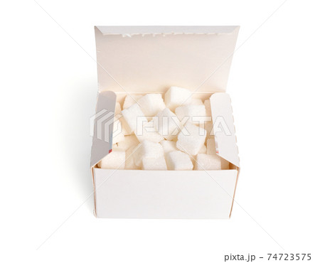 Heap of Sugar cubes on the box isolated on white background Heap of Sugar cubes on the box isolated on white background 74723575