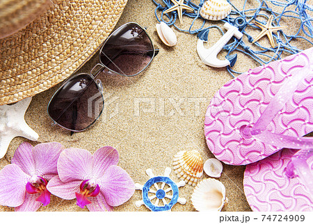 Top view  of beach accesories on sands with copy space 74724909