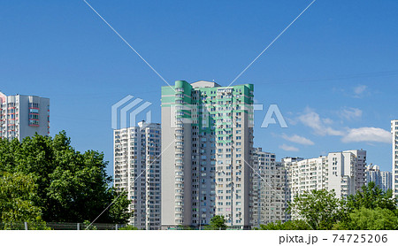 Modern residential apartment with flat buildings exterior. Detail of New luxury house and home complex. Part of City Real estate property and condo architecture. Blue sky 74725206
